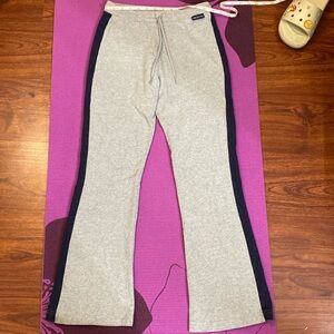 grey sweats with navy stripe on outer pant leg